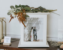 Load image into Gallery viewer, Wedding Card Box in White shown on cooper table with greens on box top